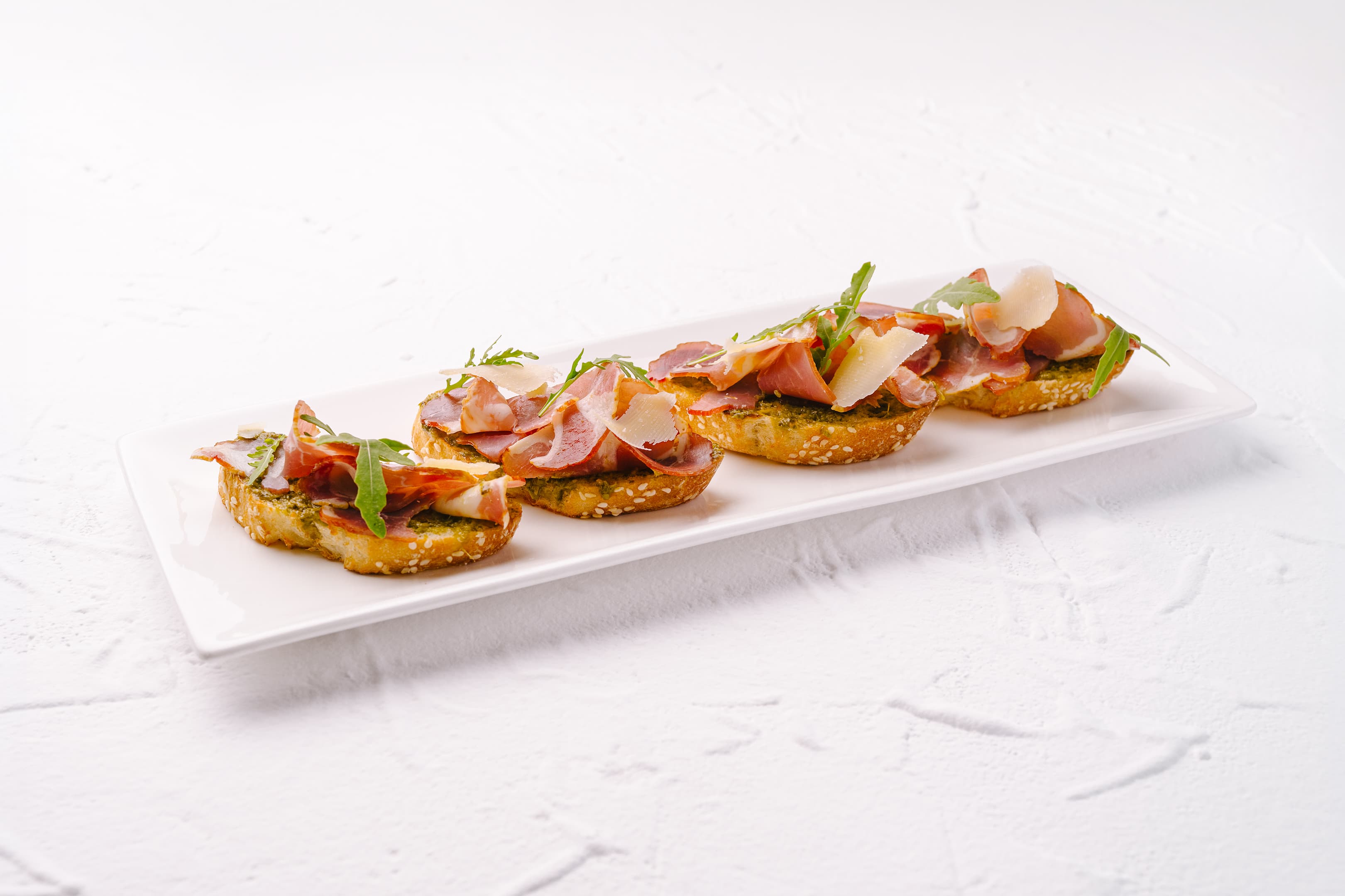 Bruschetta with Smoked Meat and Pesto Sauce